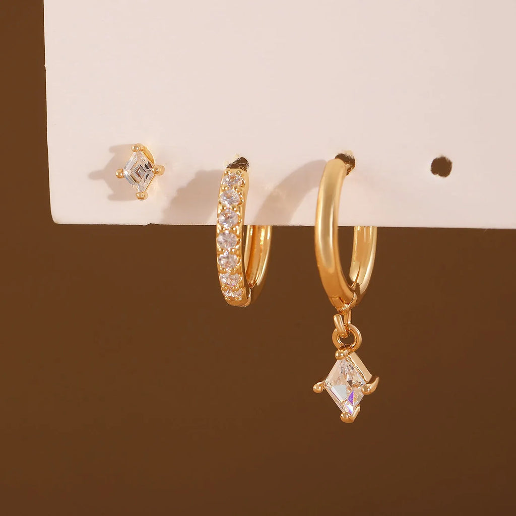 Ladies three-piece jewellery set with geometric designs and inlaid zircon stones in gold and silver colours