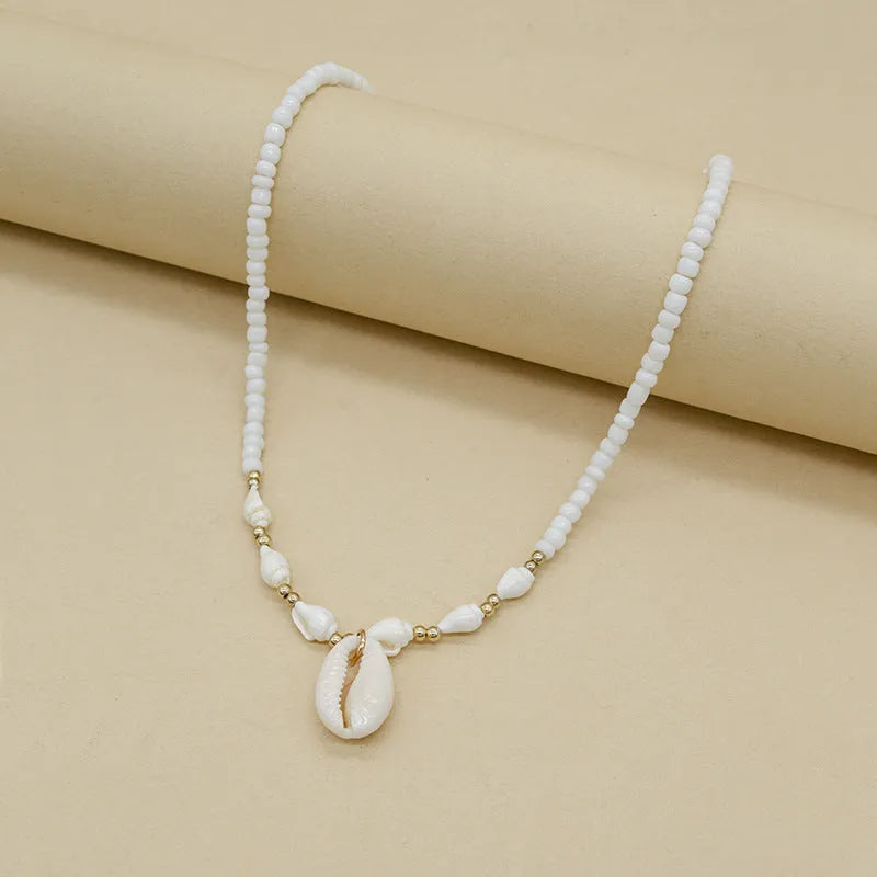 White electroplated shell necklace with mother pearl conch pendant on regular chain