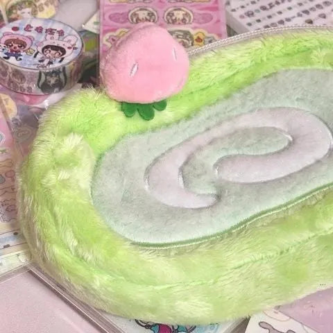 Honeydew colour velvet pencil case with swiss roll cake design for stationery storage