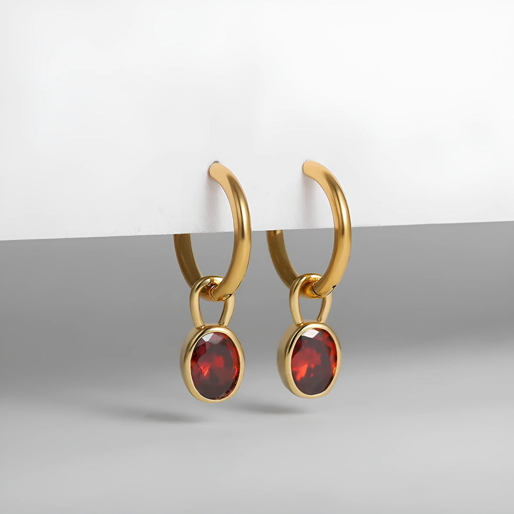 A pair of women's retro-style oval zircon stud earrings in copper, showing one of the six available stone colour options.