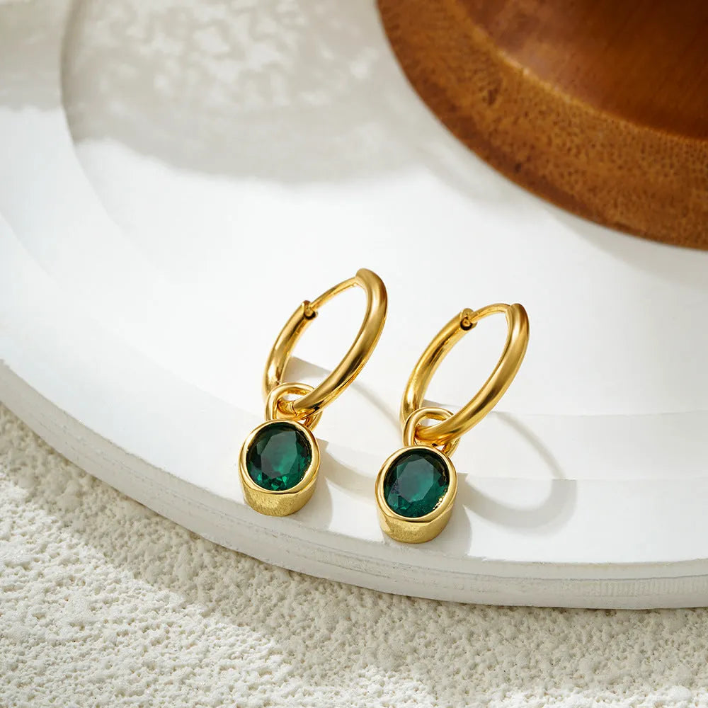 A pair of women's retro-style oval zircon stud earrings in copper, showing one of the six available stone colour options.