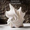 French-style retro ceramic vase with coloured glaze in a European decorative design.