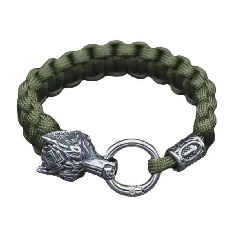 Handmade titanium steel wolf head bracelet in camouflage colour on a wrist.