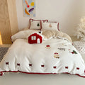 Girl's winter Christmas cartoon pattern bedding four-piece set showing duvet cover, sheet, and pillowcases