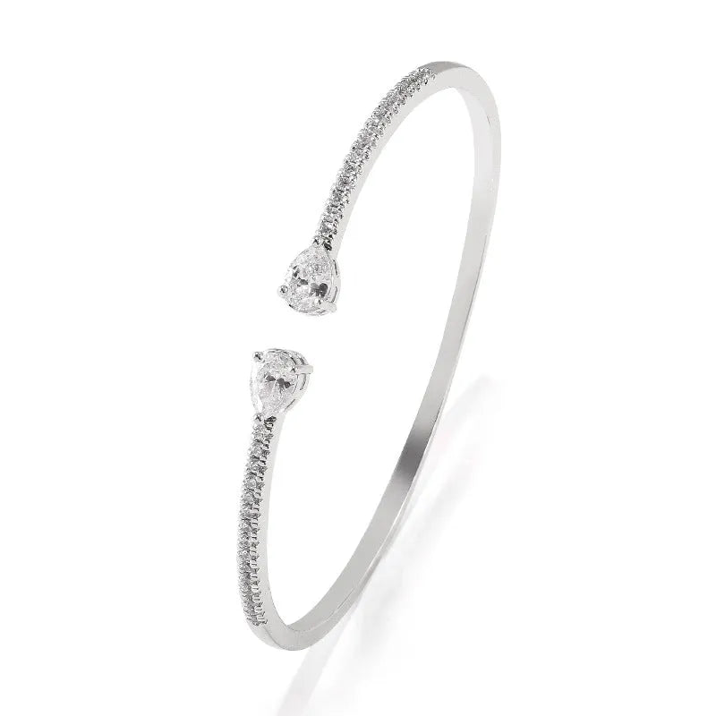 Multi-zircon fashion bracelet crafted from copper with zircon inlaid treatment in white or blue colour