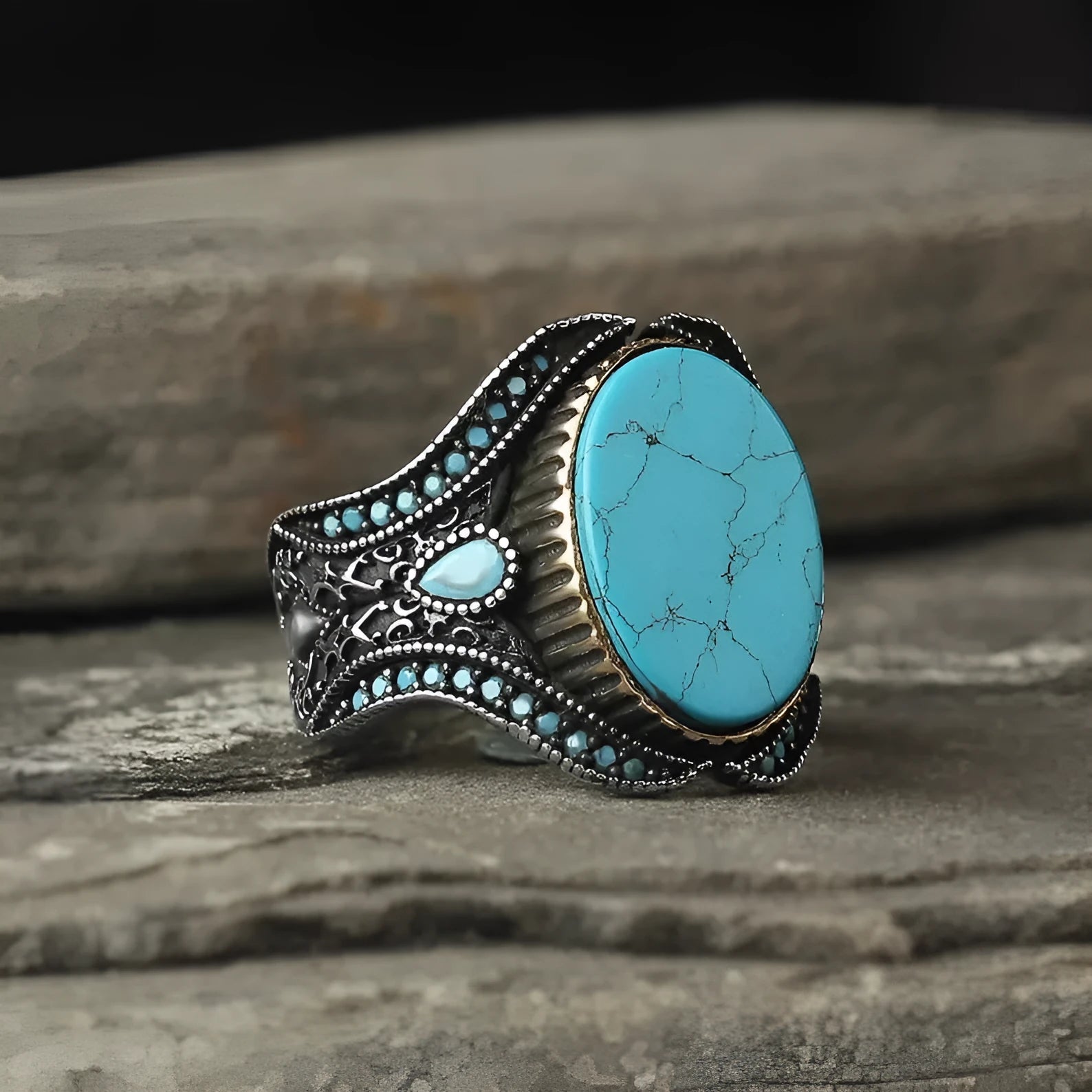 Men's round turquoise ring with antique silver metal band, shown in size 10.