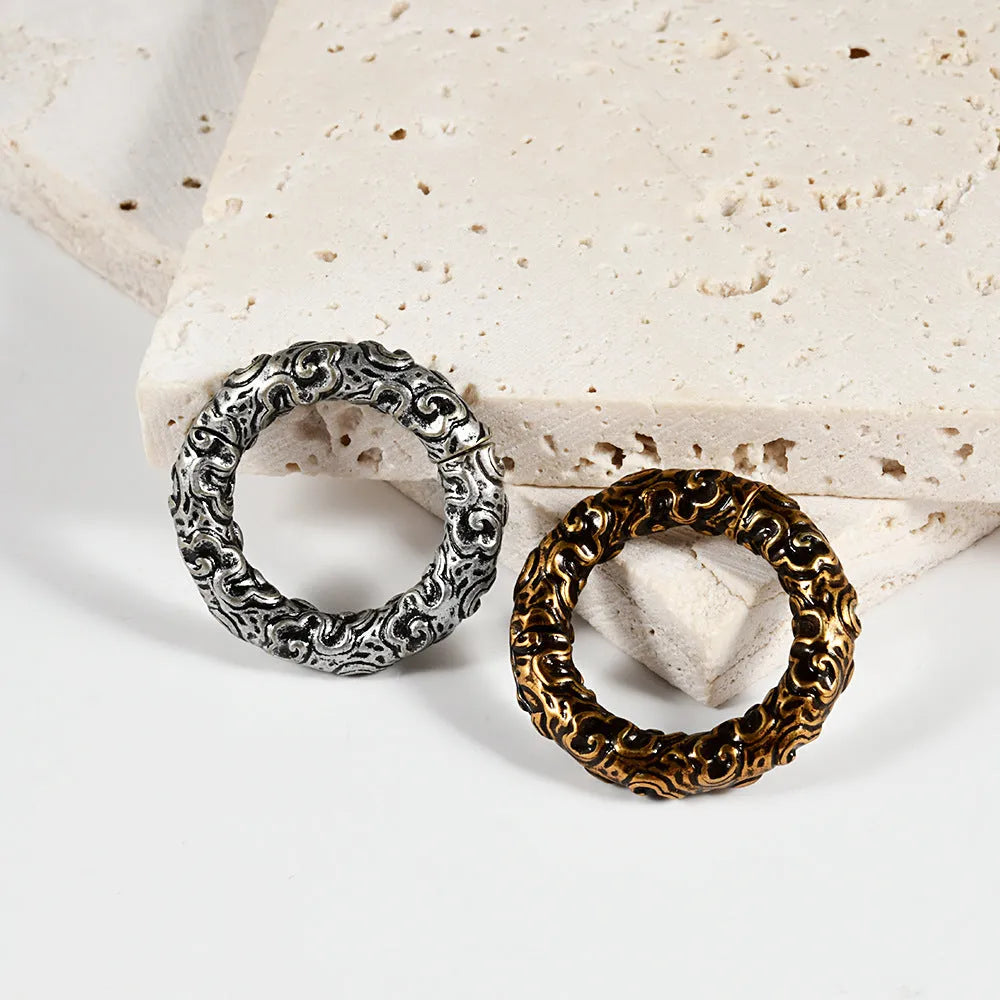 Stainless steel totem patterned fashion earrings with electroplated finish