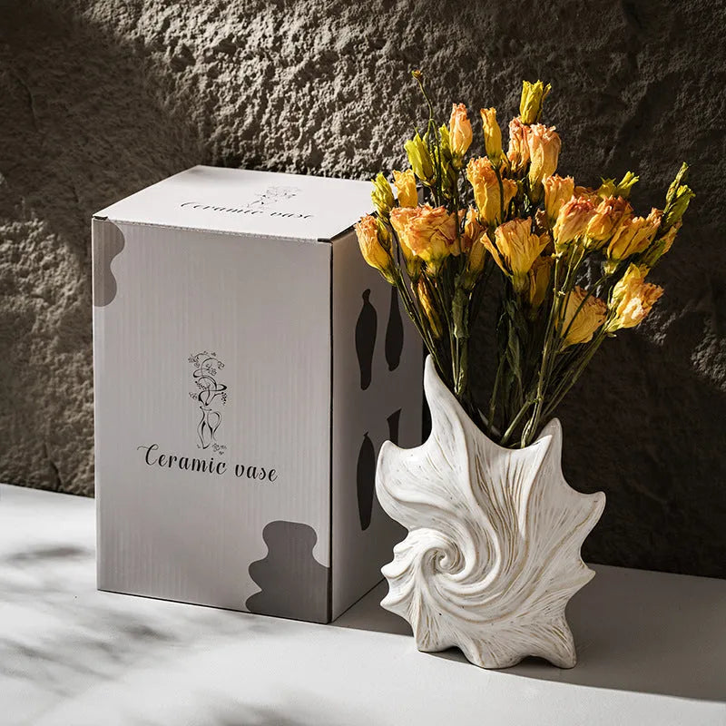 French-style retro ceramic vase with coloured glaze in a European decorative design.