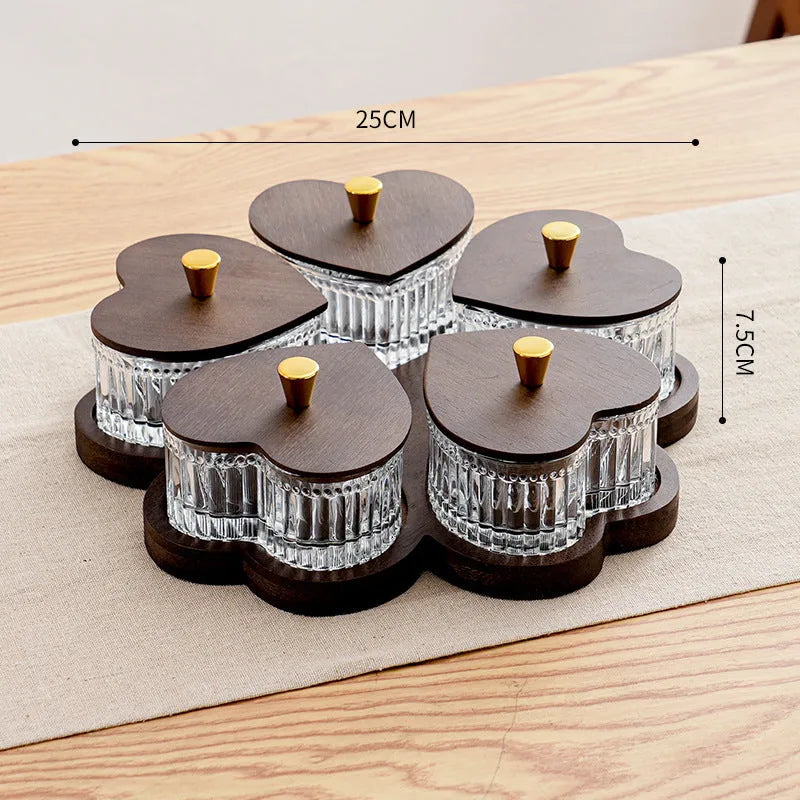 Glass snack plate with heart-shaped lids on a multi-grid tray in a retro style.