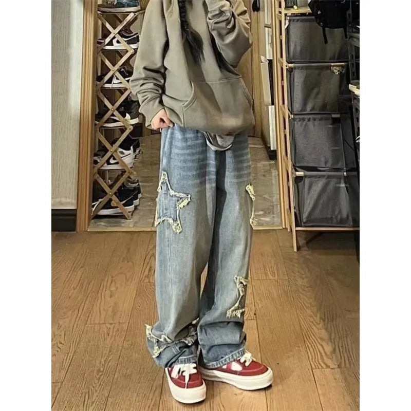 Blue high waist straight leg women's jeans on a hanger.