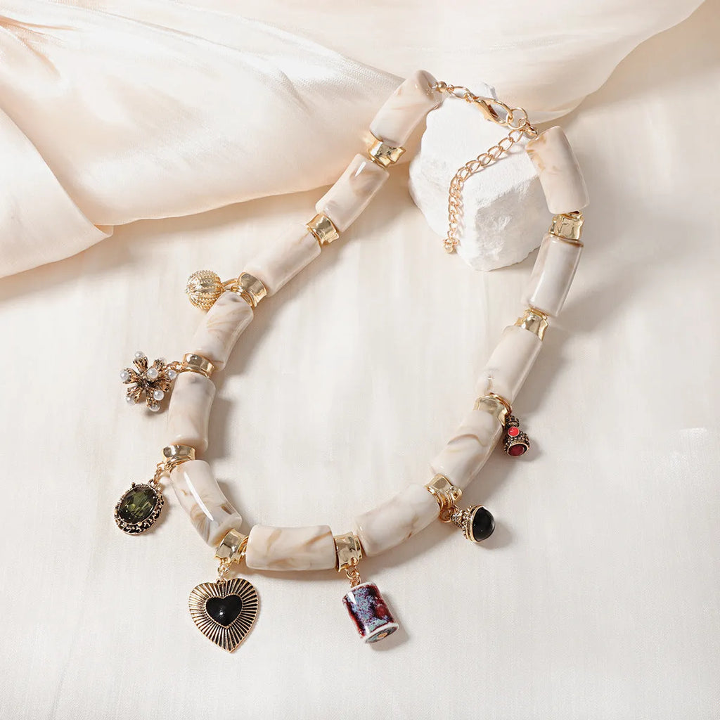 Resin bamboo necklace with heart-shaped pendant and electroplated finish