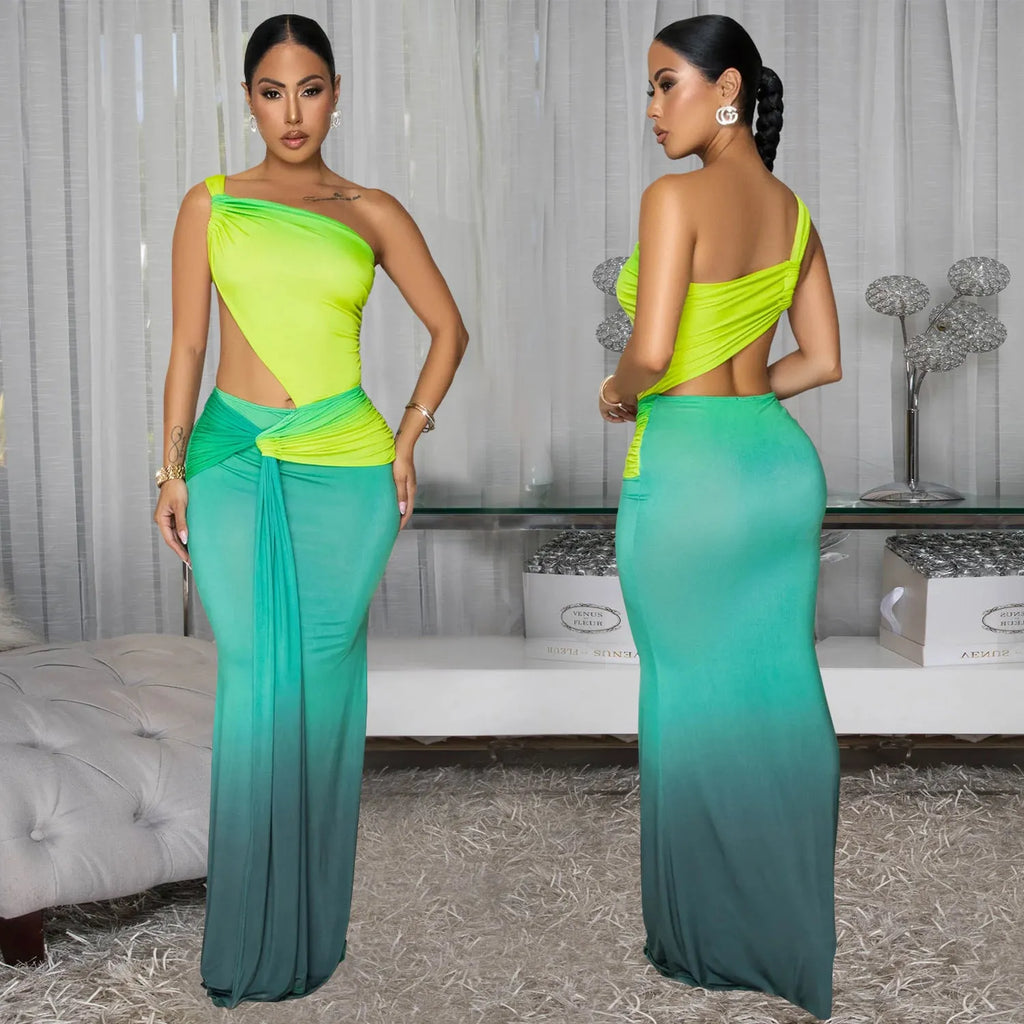 Brown gradient sleeveless dress with cross-shoulder straps and a long skirt on a model.