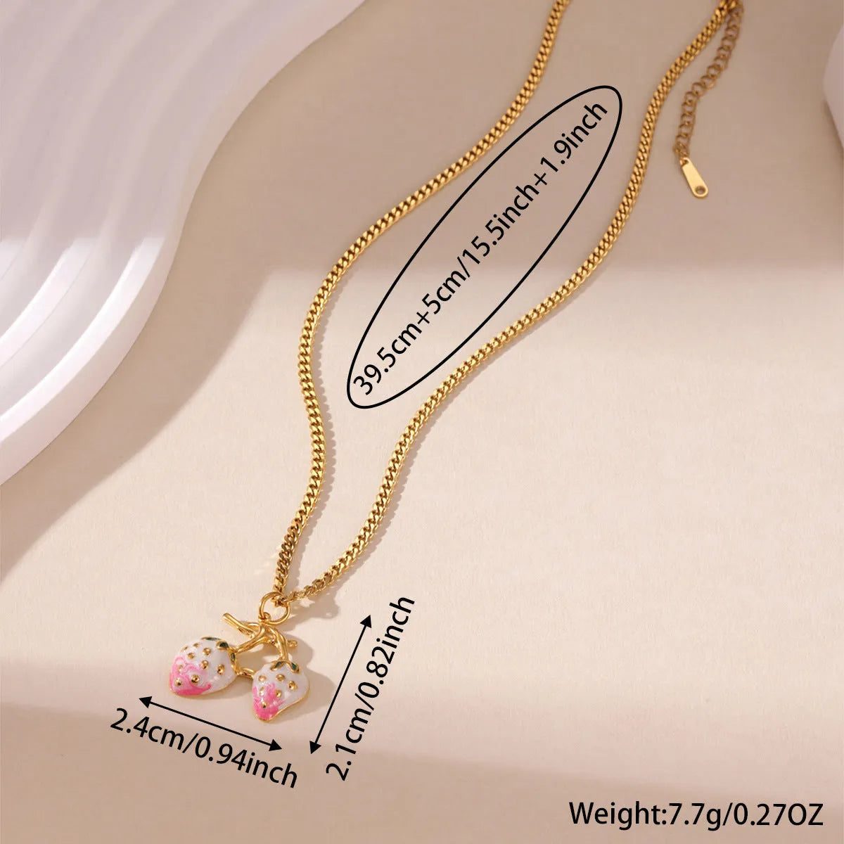 Women's strawberry fruit pendant necklace in red and white gradient colours on an alloy chain.