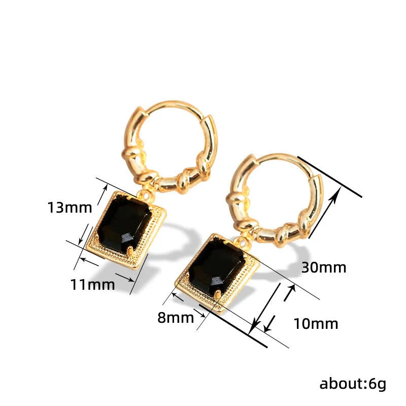 A pair of black geometric quadrilateral zircon earrings with a French Court retro design on a white background.