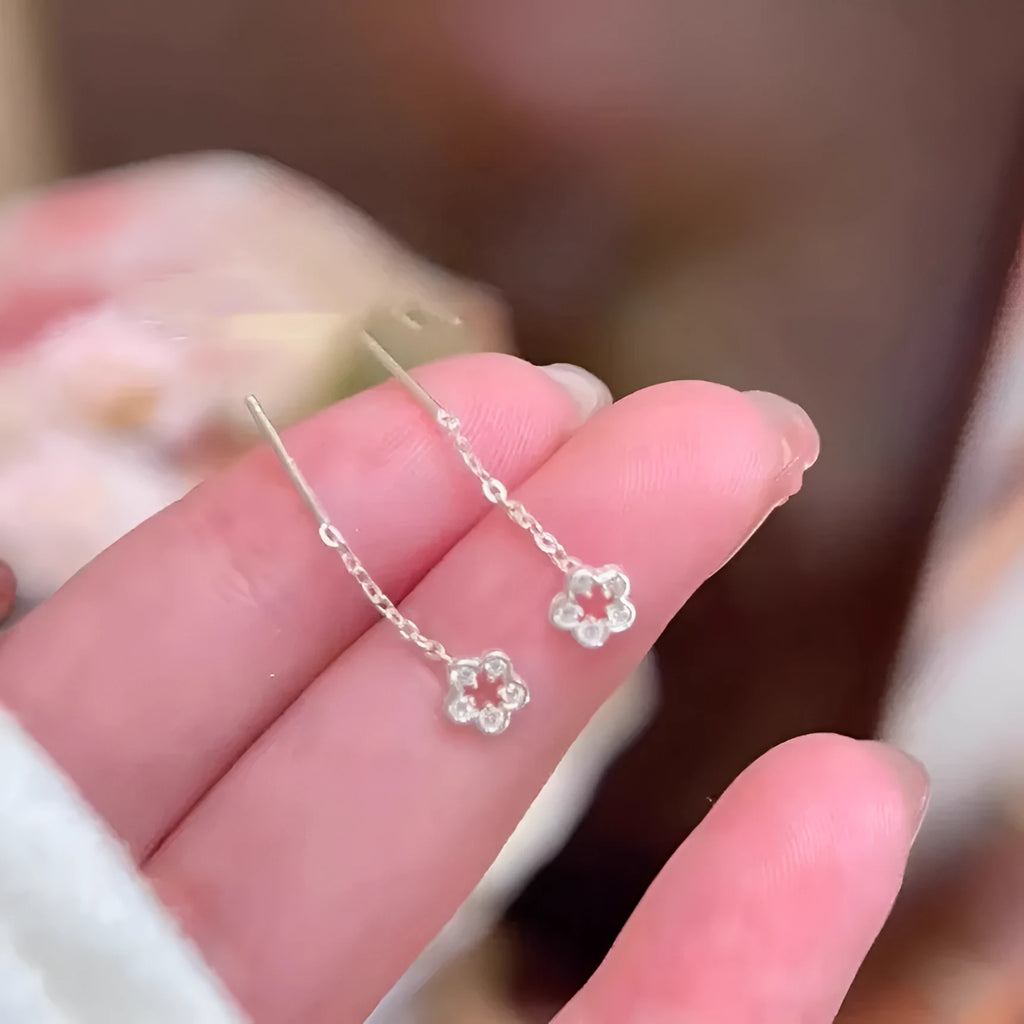 Silver hollow flower hanging earrings with petal design on alloy studs