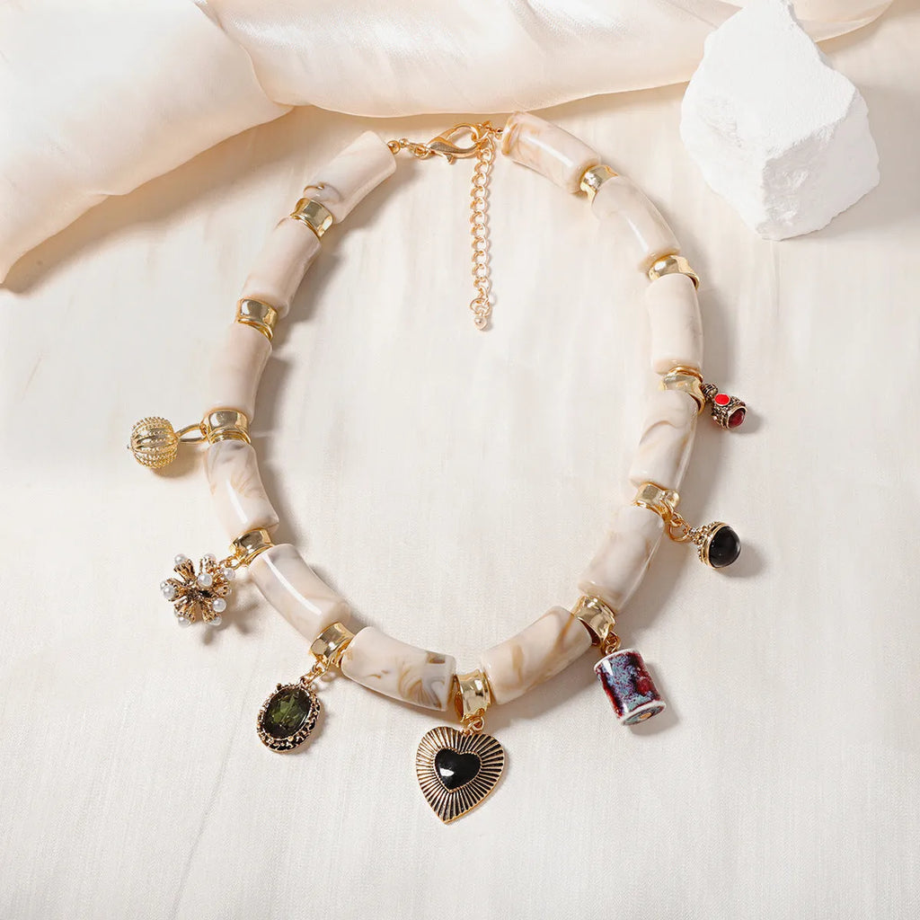Resin bamboo necklace with heart-shaped pendant and electroplated finish