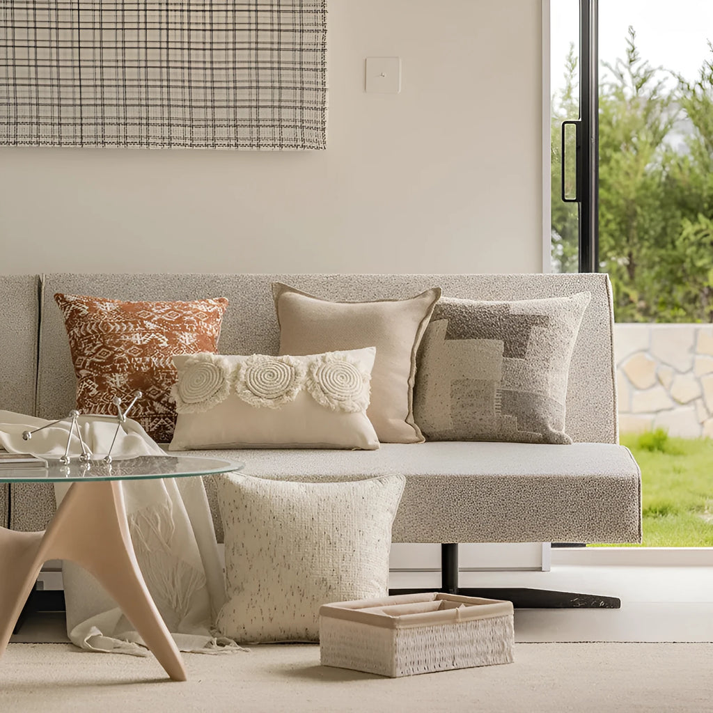 Coreless pillow cushion with pp cotton filler in solid colours on a sofa.