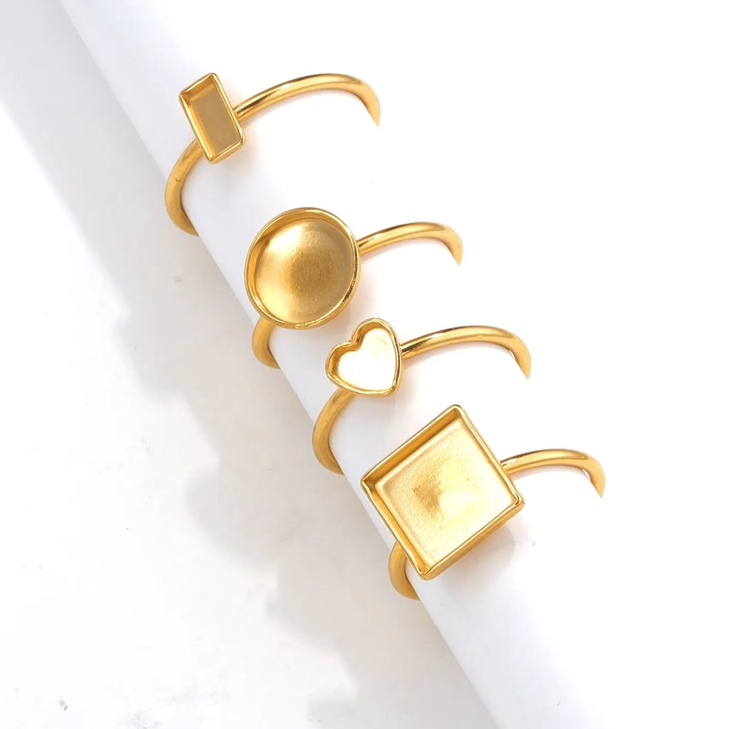 Stainless steel golden electroplated ring settings in multiple shapes including oval, heart, rectangle, round and square