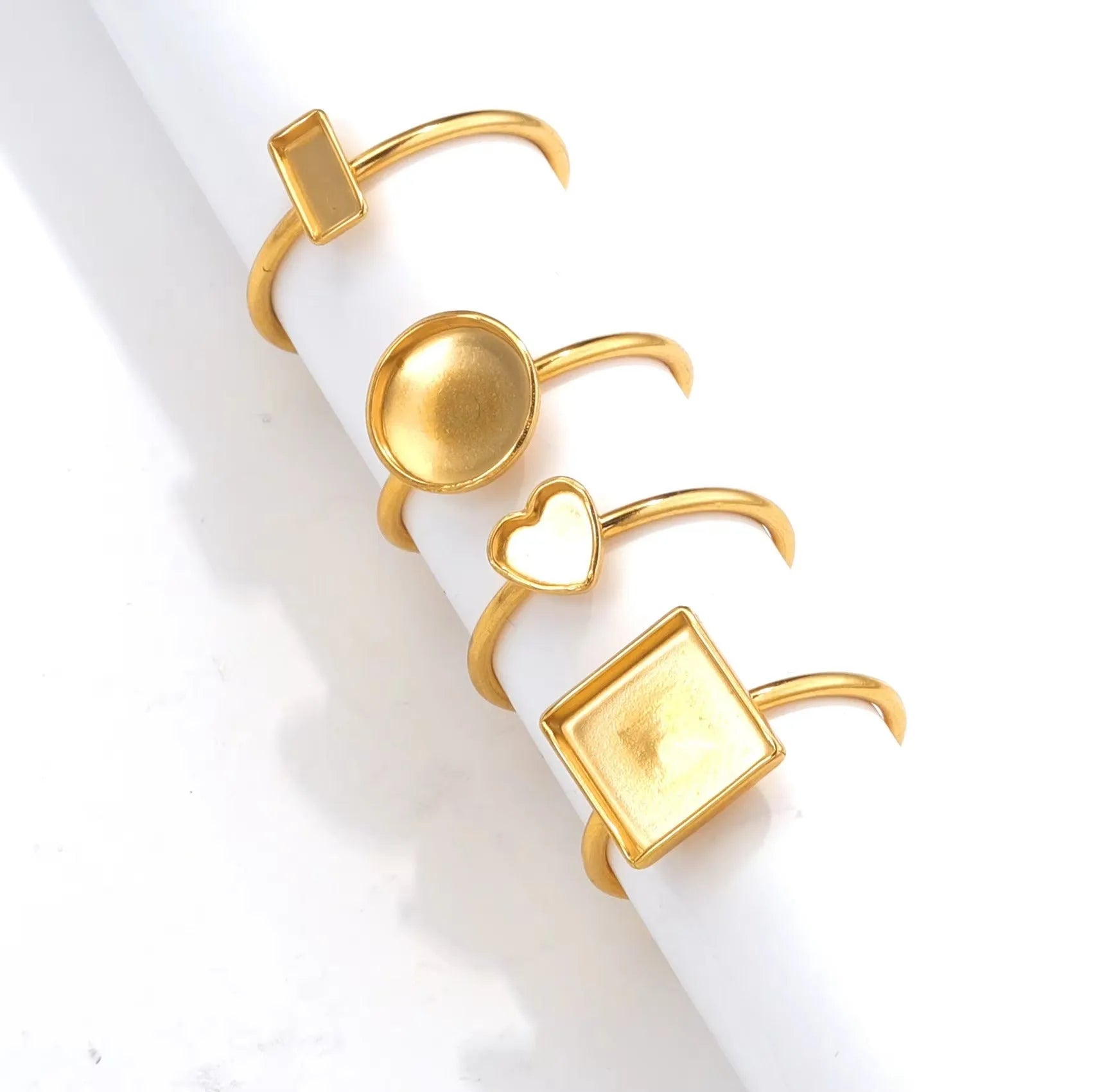 Stainless steel golden electroplated ring settings in multiple shapes including oval, heart, rectangle, round and square