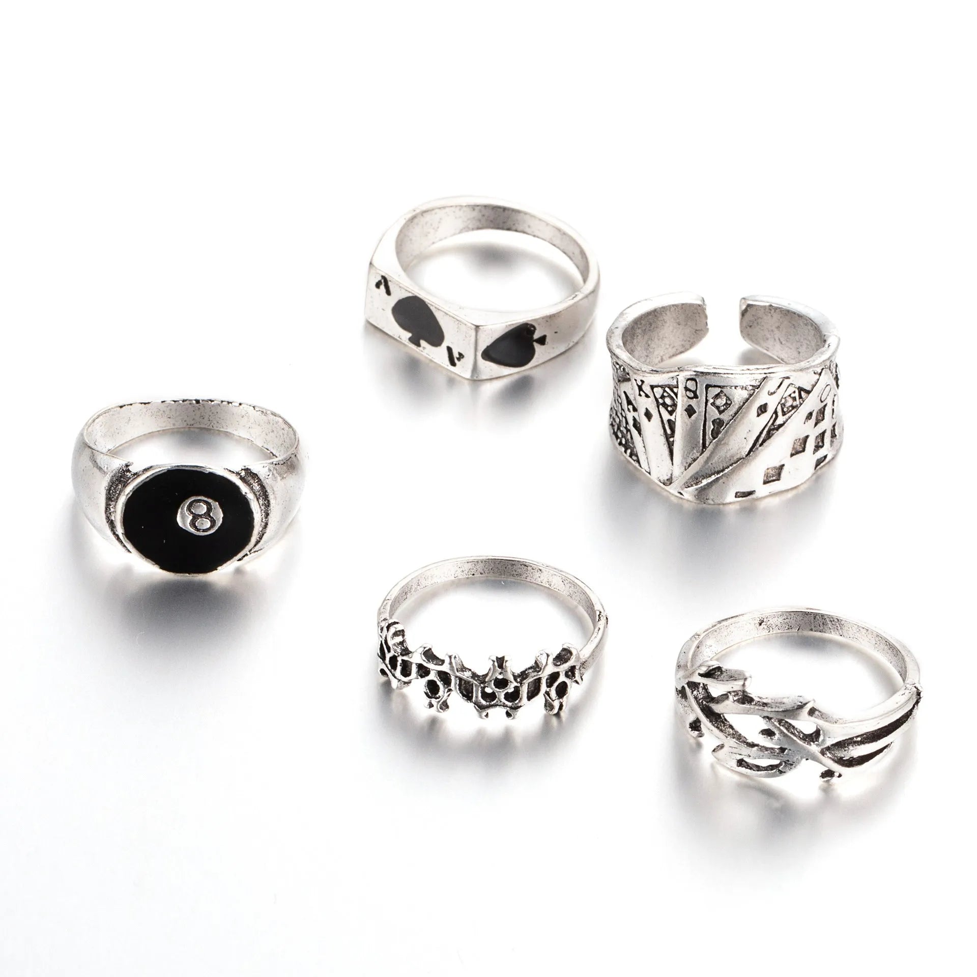 Black alloy poker ring with a retro spade card design on a finger.