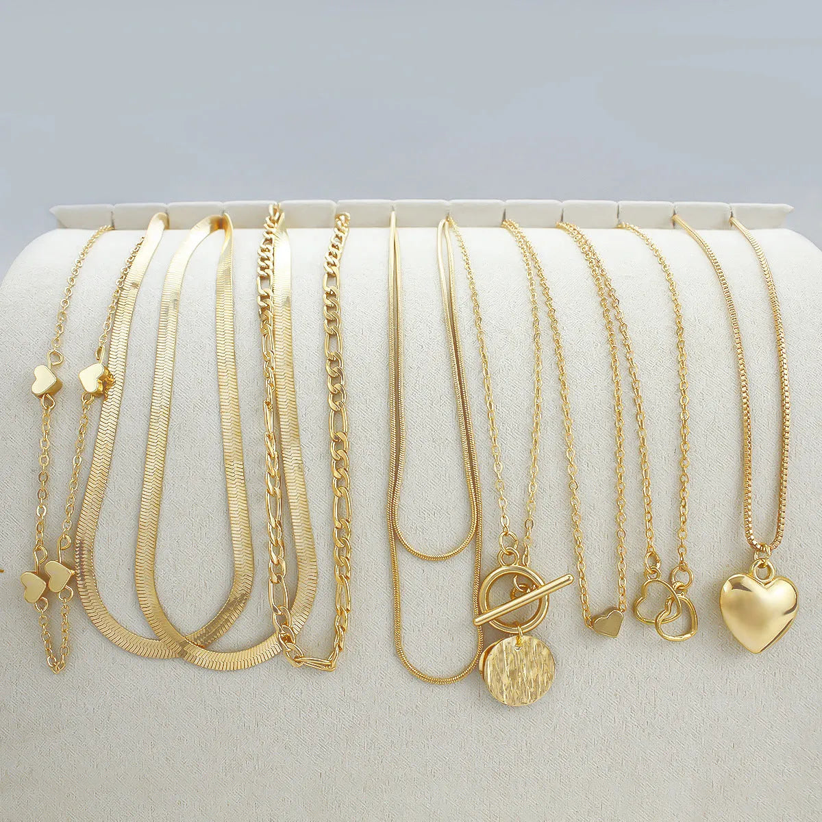 10-piece gold electroplated women's necklace set with snake bone chains and alloy pendants