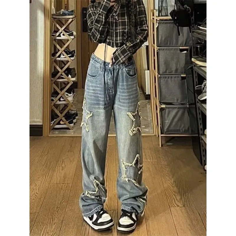 Blue high waist straight leg women's jeans on a hanger.