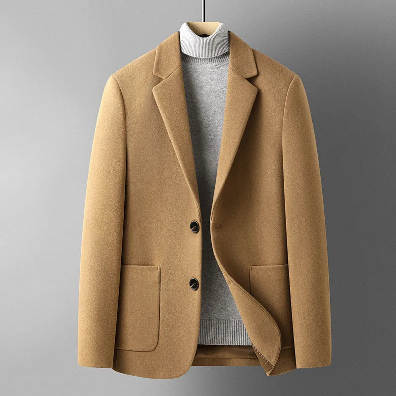 Slim fit men's wool suit jacket in grey, shown on a hanger.