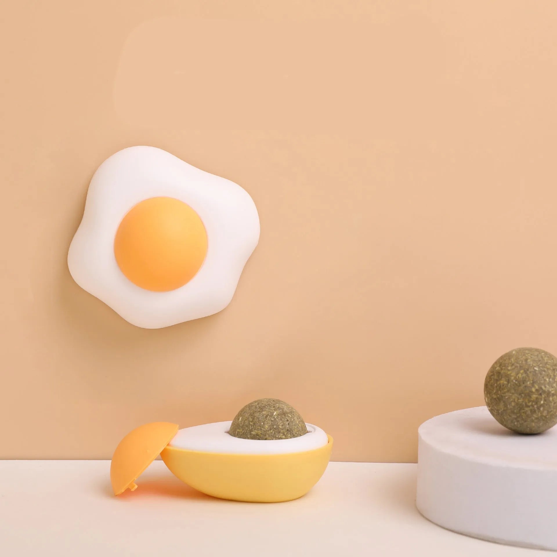 Soft plush egg-shaped cat toy filled with catnip and silvervine for wall and floor play.