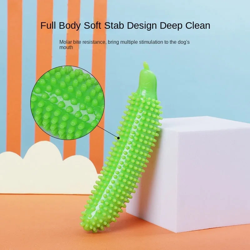 Green cucumber-shaped dog chew toy for teething and bite training on a white background.