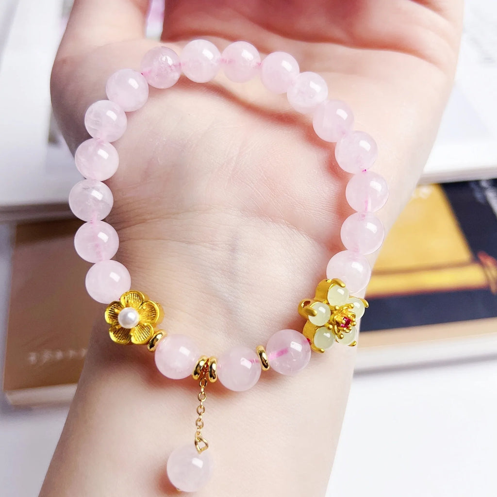 Pink crystal NAFU Peach Blossom bracelet for women on wrist.