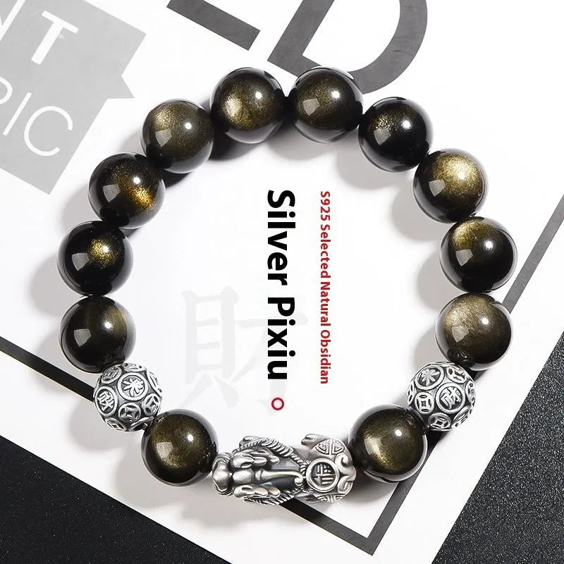 Men's geometric bracelet with obsidian stone set in 999 sterling silver on a wrist.