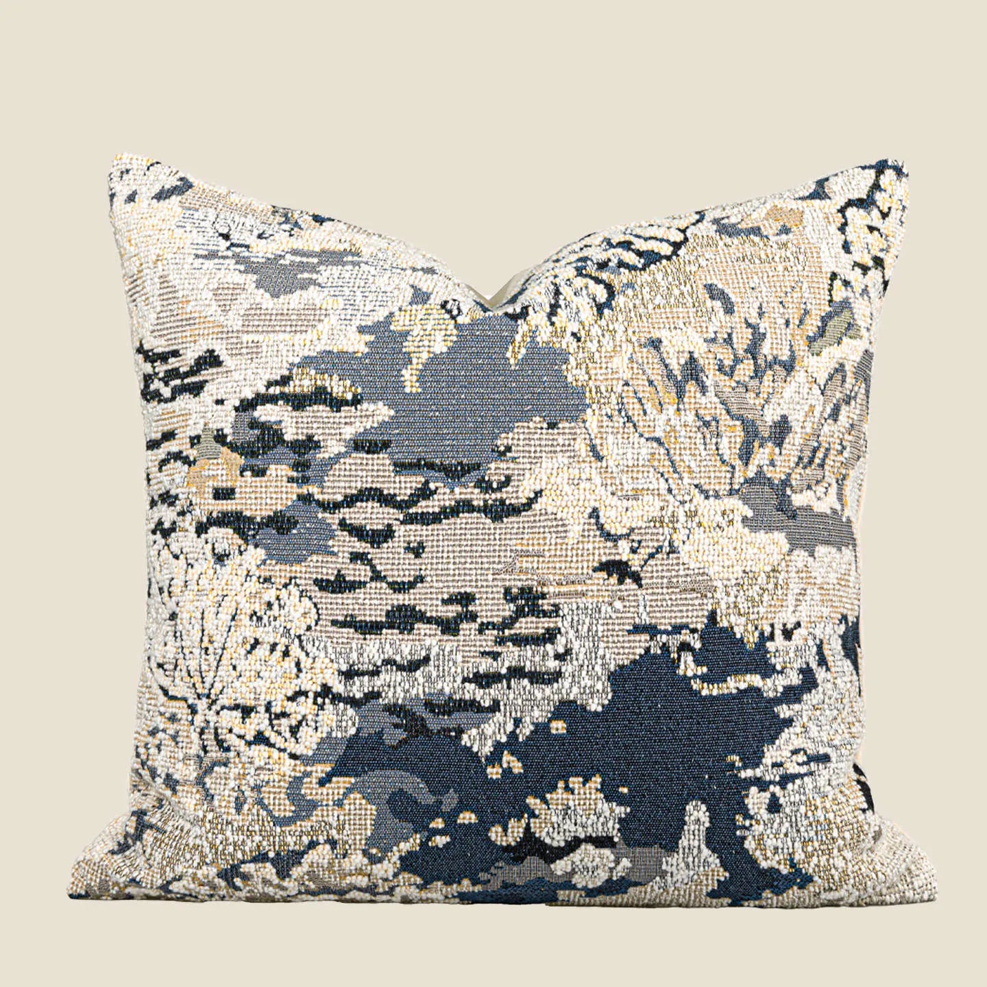 Blue abstract floral patterned decorative pillow on a sofa, showing square and rectangular sizes.