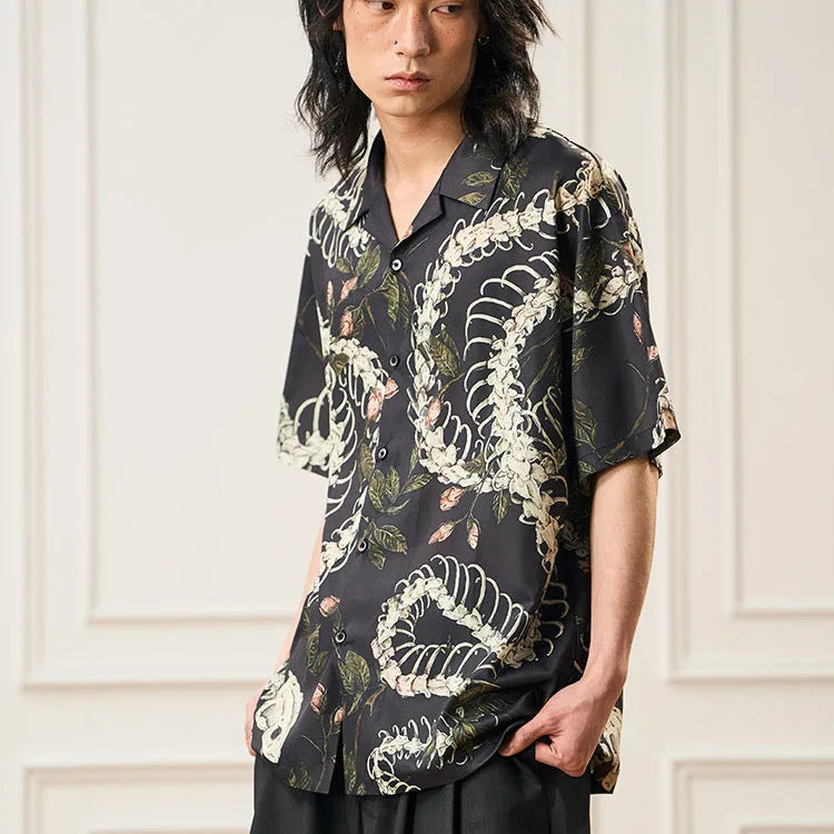 Men's loose fit short sleeve shirt with snake bone floral print and a Cuban collar.
