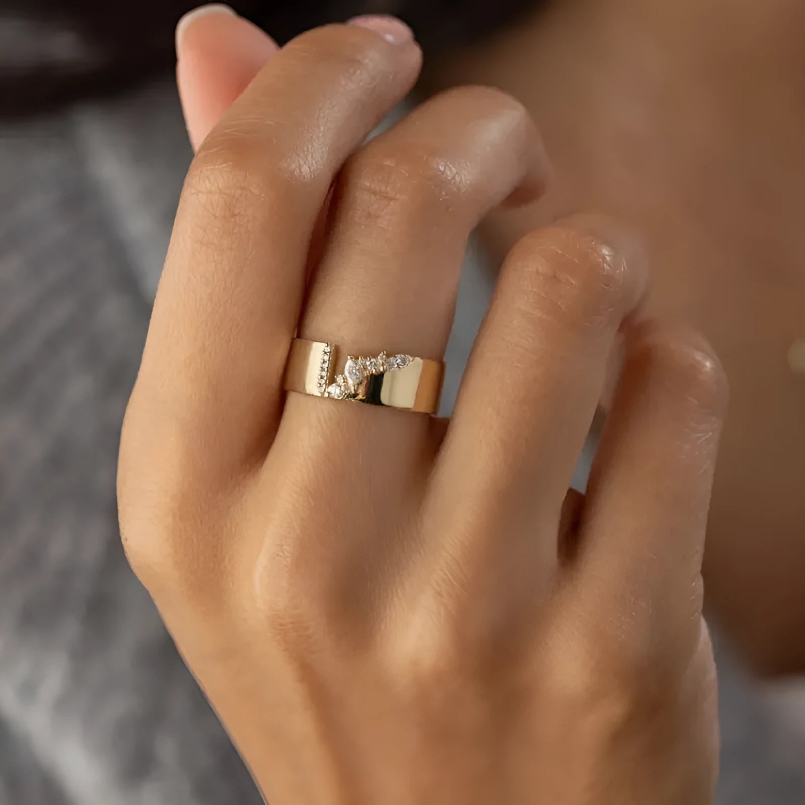 Gold electroplated copper women's ring with zircon stones showing UK size markings 6-10