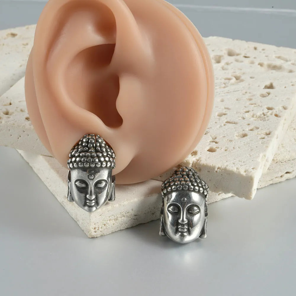 Stainless steel hollow skull Buddha head geometric earrings in four colour options.