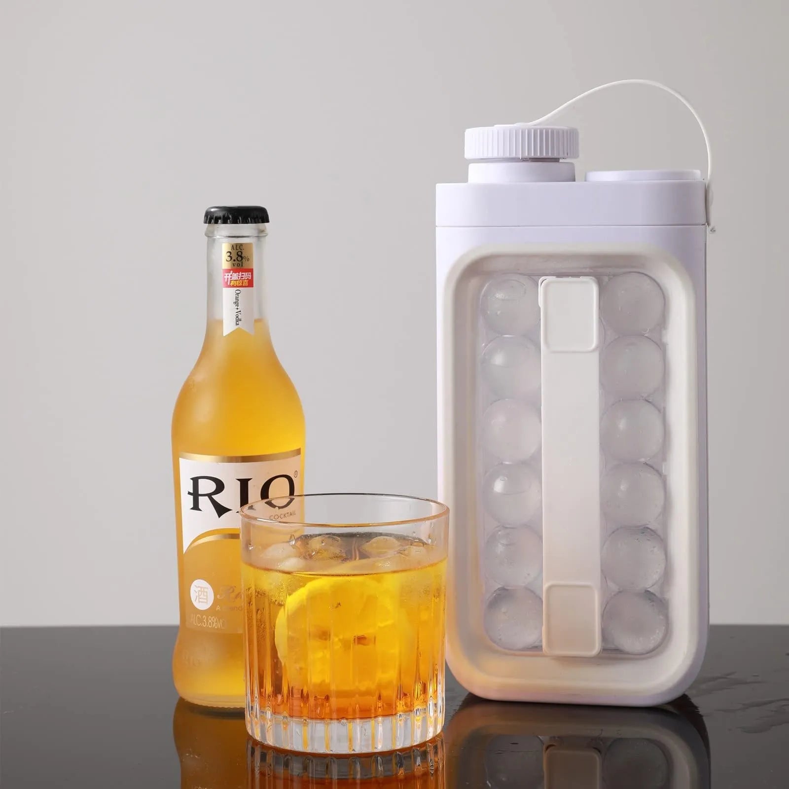 Light blue and white 2-in-1 ice ball cold kettle showing ice tray and bottle functions