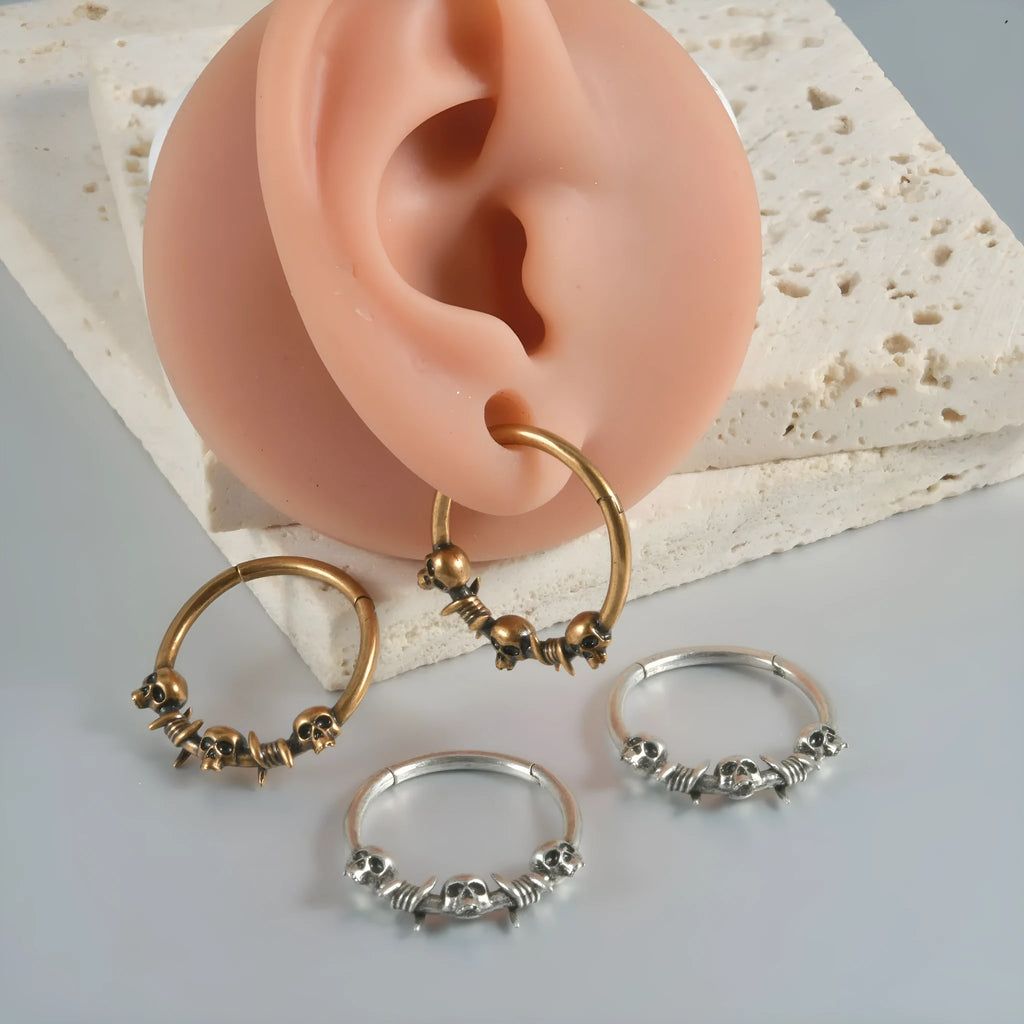 Copper punk earrings with ghost head design in antique gold or silver finish.