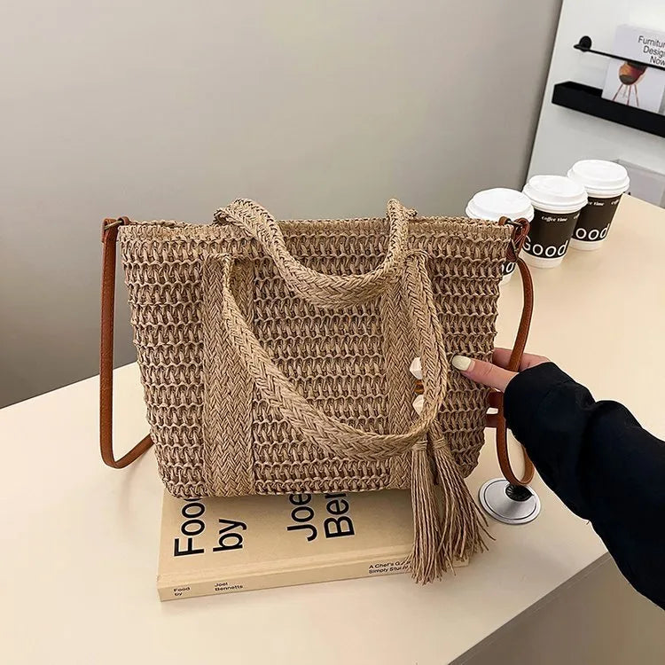 Women's straw crossbody shoulder bag with woven texture in milky white colour showing large capacity interior