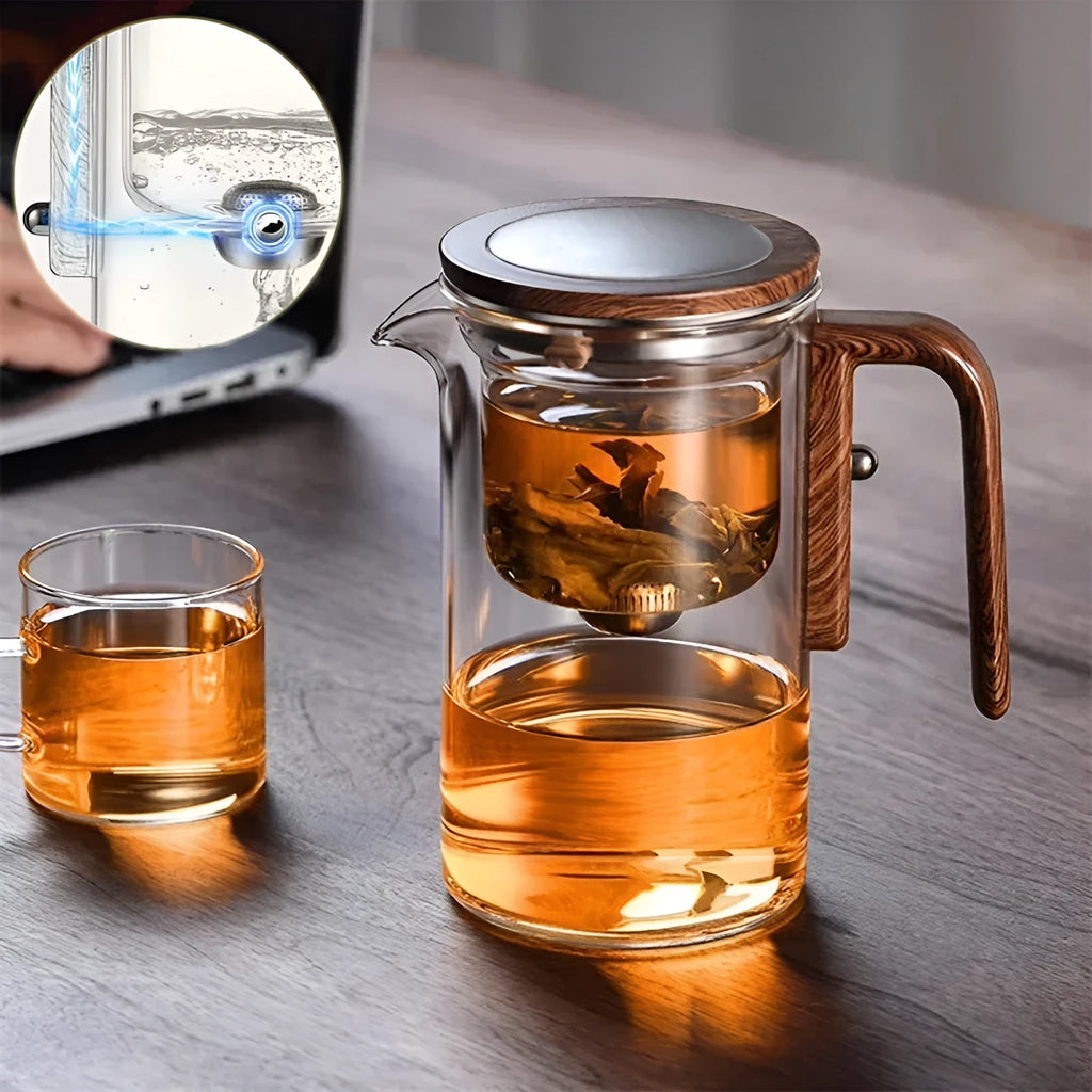 Chinese-style glass teapot with wooden handle showing magnetic filtration button and inner infuser container.