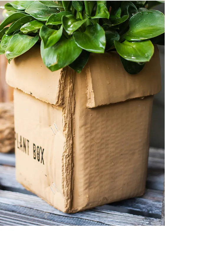 Cement flowerpot with brown paper box finish and drainage holes in bottom