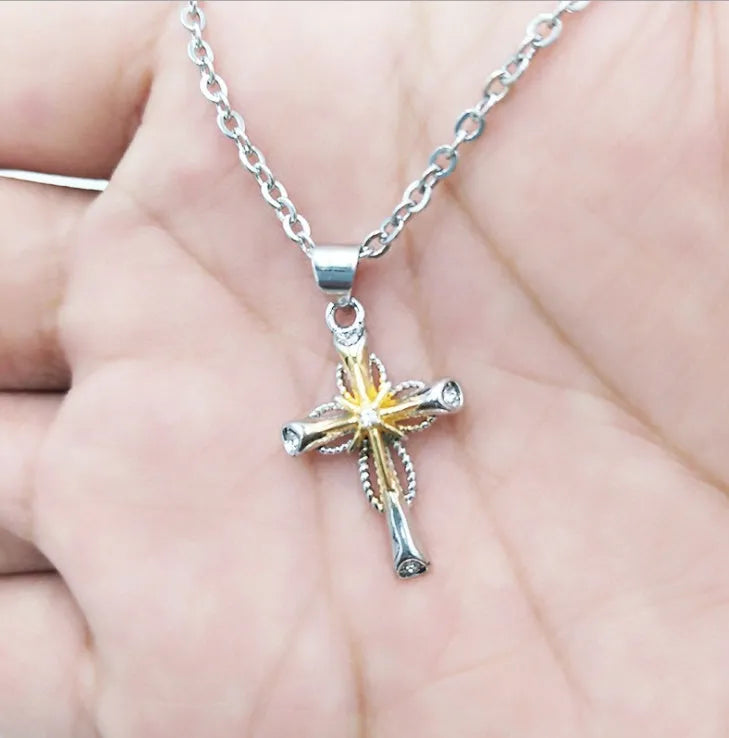 Silver alloy cross pendant with octagonal star detail on ring chain, 22x15mm size