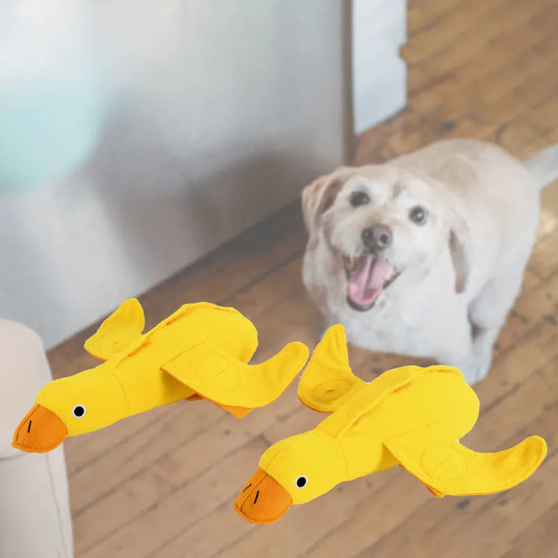 Yellow teddy dog toy with duck sound mechanism and food leak holes for treat dispensing