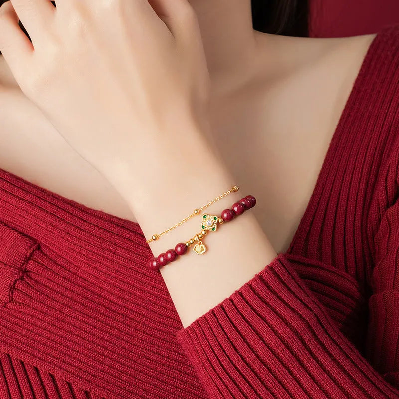 Sterling silver women's bracelet with geometric Ruyi and Xiangyun Chinese motifs and cinnabar red flower detailing