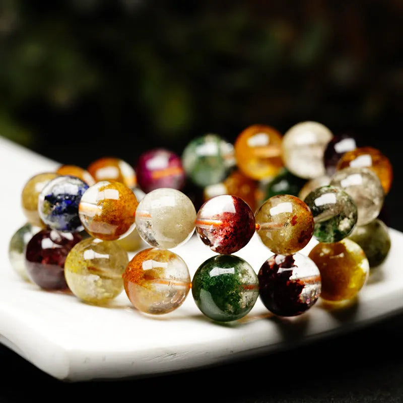 Crystal bracelet with 10mm beads showing colourful four seasons stones in ghost cornucopia ethnic design