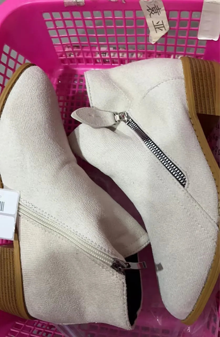 Women's beige suede ankle boot with side zip, lace-up front, and chunky composite sole.