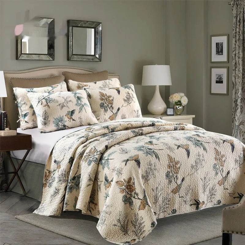 Quilted pure cotton bed cover set with printed pattern on a double bed with matching pillowcases.