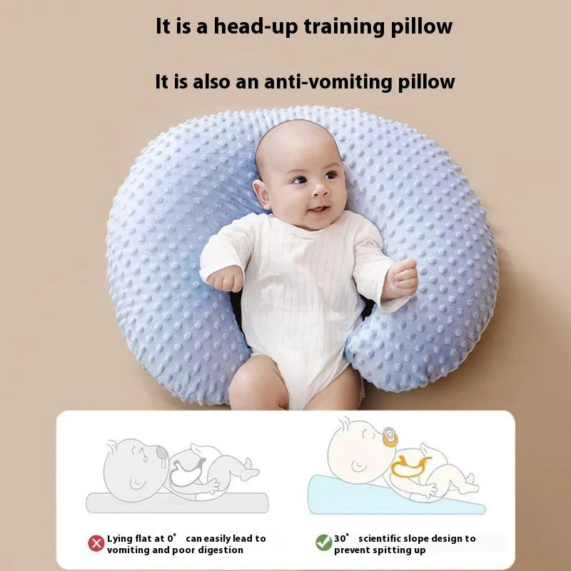 Multifunctional nursing pillow with a raised spill-prevention ridge in a light blue colour.
