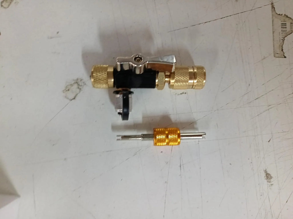 Vacuum valve core disassembly tool set with black and pink metal valve removers in different thread sizes