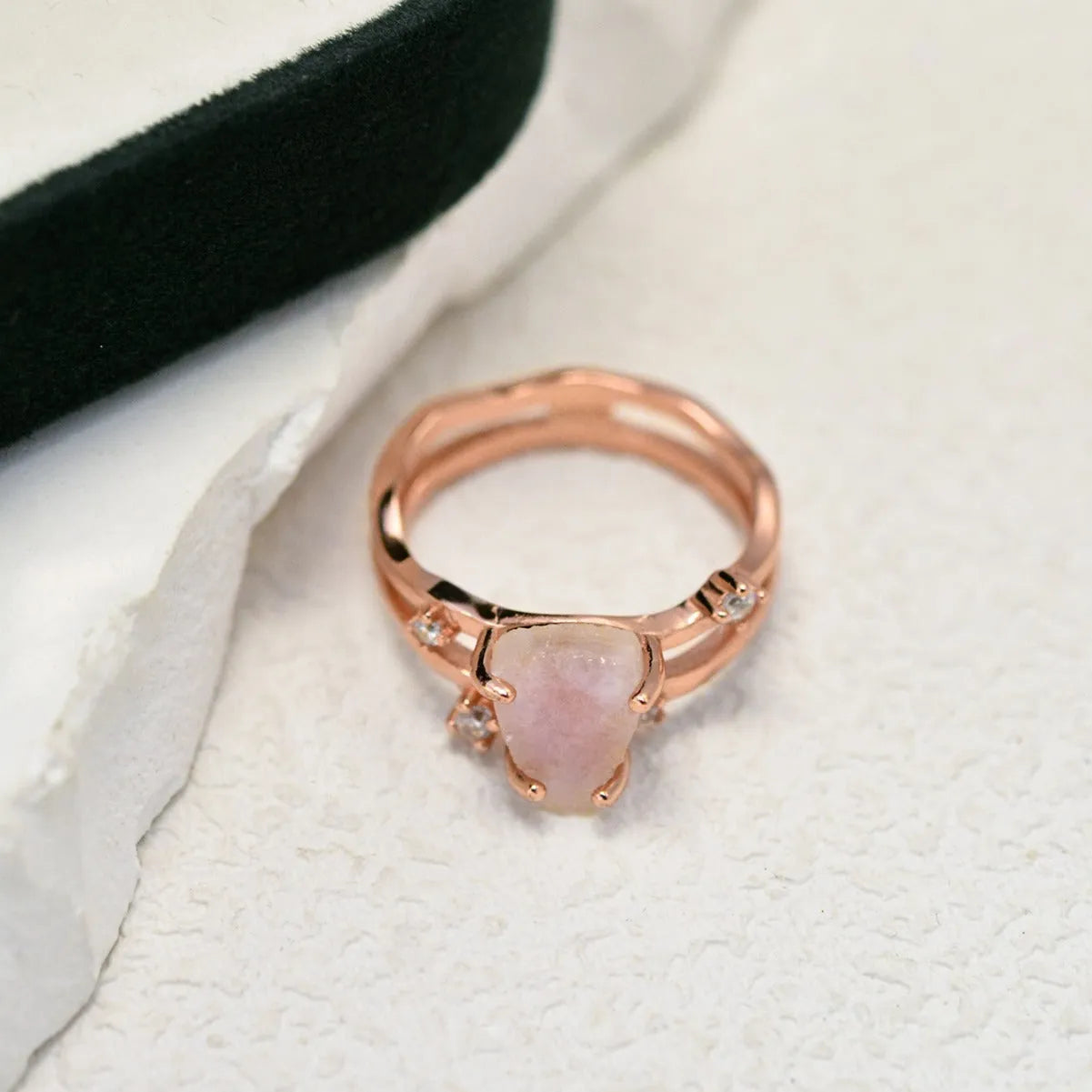 S925 sterling silver ring with irregular triangle shape, moonstone, and electroplated rose gold finish.