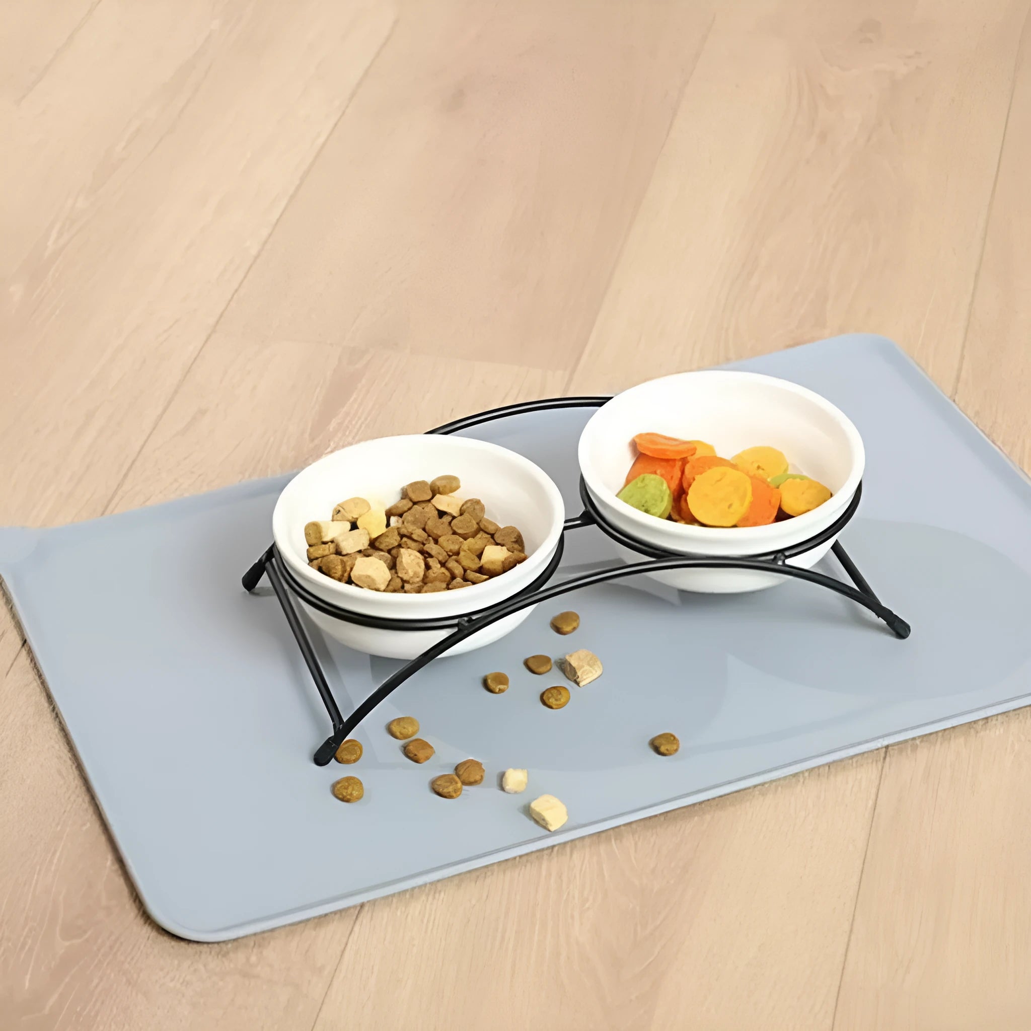 Silicone pet placemat for under food bowls in blue, shown next to a dog bowl.